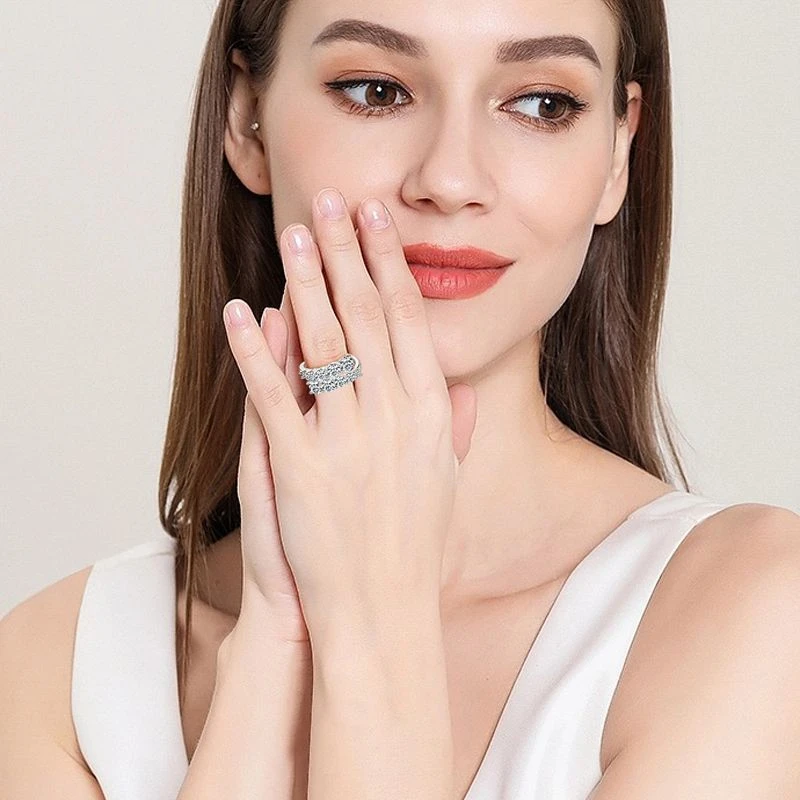 Moissanite twist ring with double row pavé setting in S925 sterling silver by Mireli Jewelry